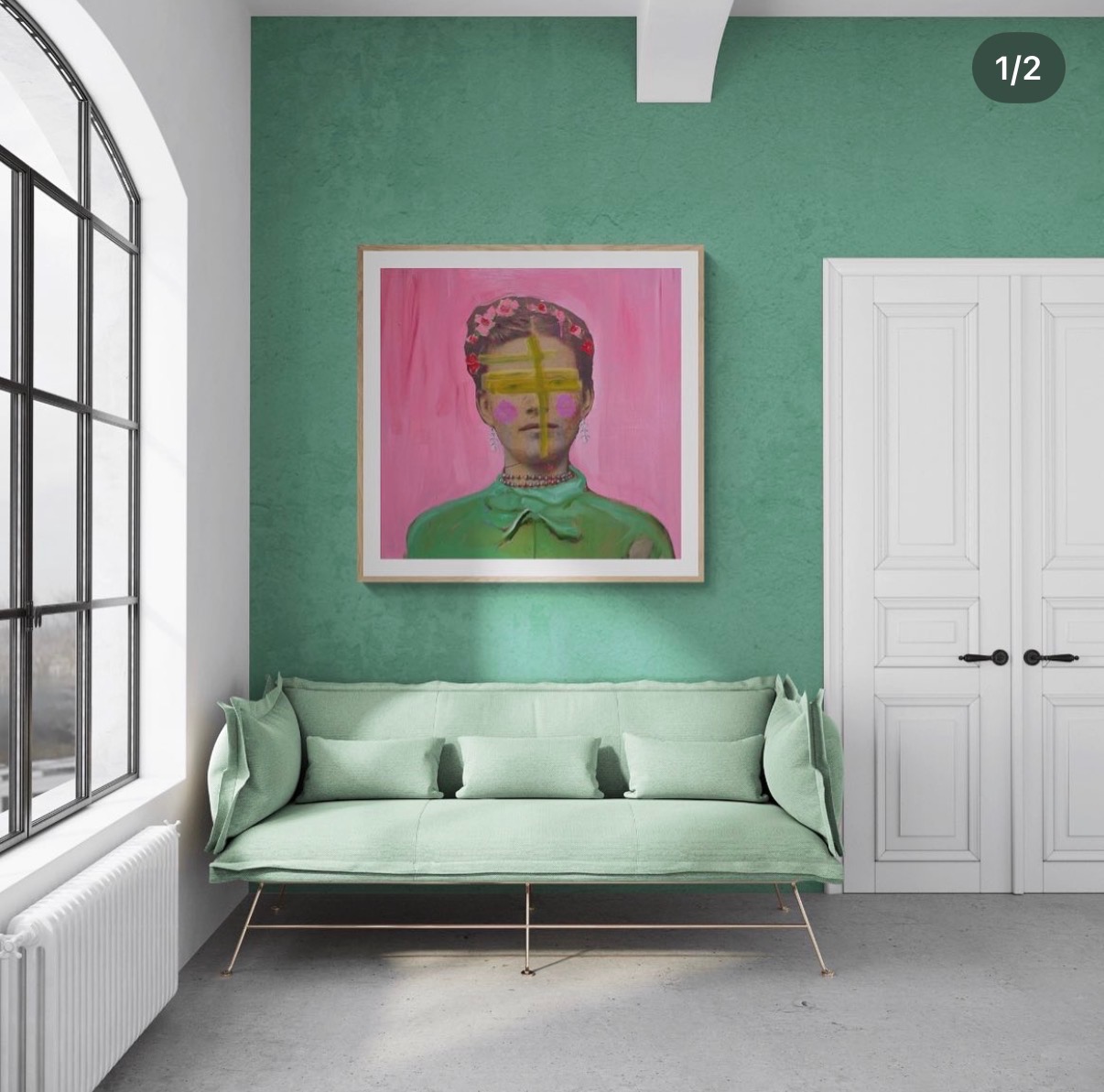 Annie Decamp vibrant portrait of a woman with a yellow cross over her face on a textured green wall above a sofa