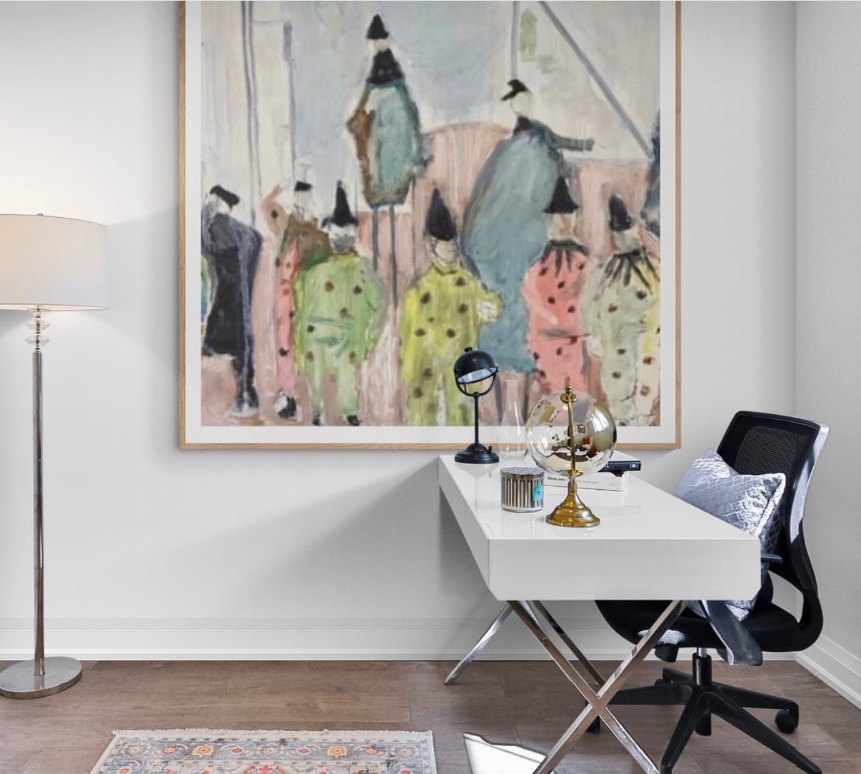 Annie Decamp framed abstract painting of figures in polka-dotted costumes above a home office desk